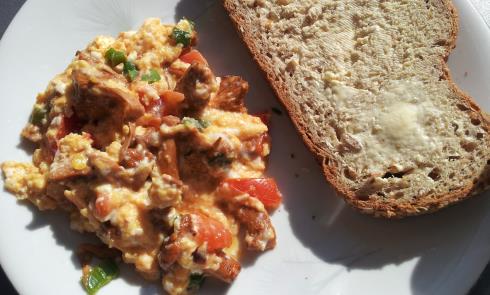 scrambled eggs with chanterelle chives and tomato